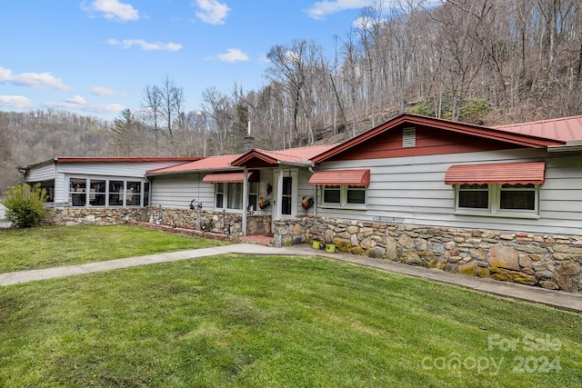 ranch-style house with a front yard