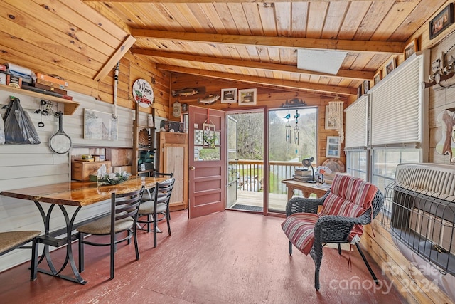 sunroom / solarium with vaulted ceiling with skylight and wood ceiling