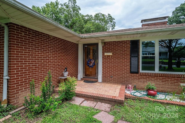 property entrance with a patio