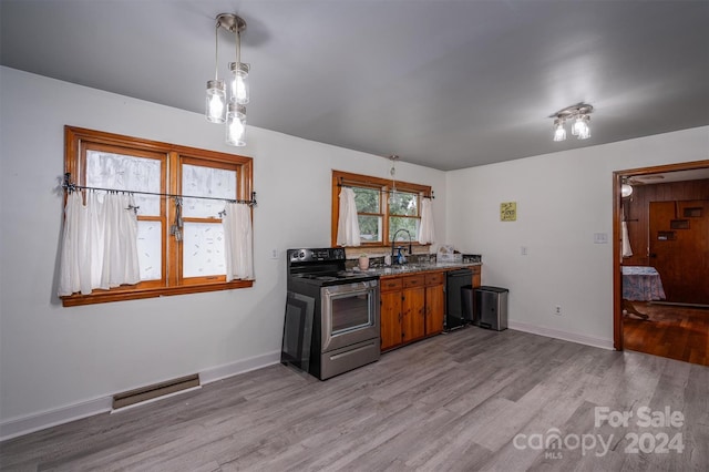 kitchen with sink, stainless steel electric range, light hardwood / wood-style floors, and black dishwasher