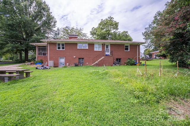 back of house with a yard