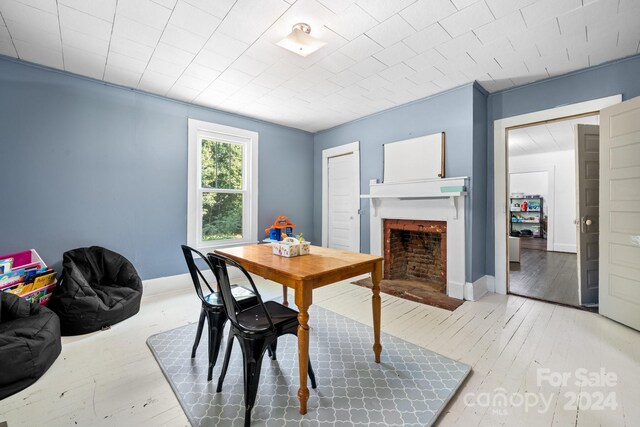 dining space with hardwood / wood-style floors