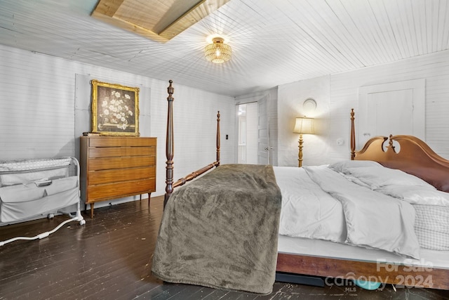 bedroom featuring dark hardwood / wood-style flooring