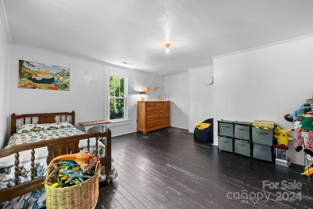 bedroom featuring dark hardwood / wood-style flooring