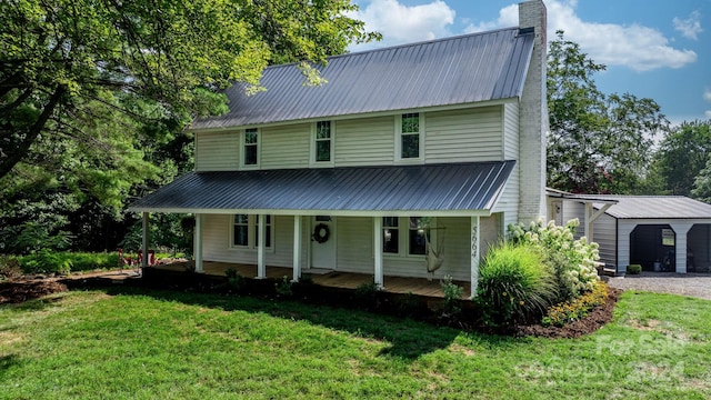 view of front of home with a front yard and a porch