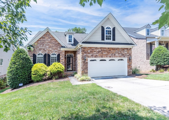 view of front of property with a garage and a front yard