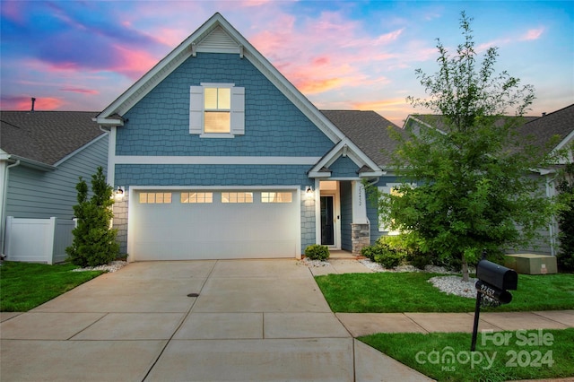 craftsman-style home with a garage