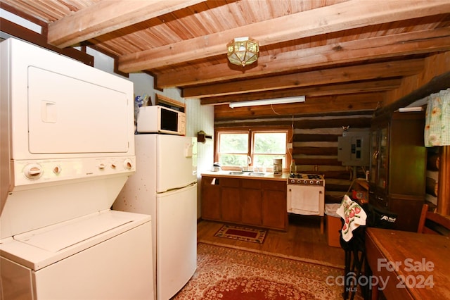 interior space with sink, rustic walls, light wood-type flooring, stacked washer and clothes dryer, and wooden ceiling