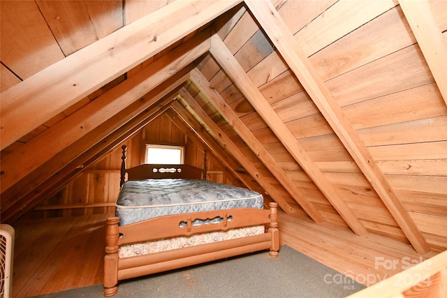 bedroom with wood ceiling, lofted ceiling with beams, and hardwood / wood-style flooring