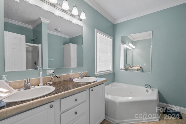 bathroom featuring ornamental molding, tile patterned floors, double sink vanity, and a bathtub