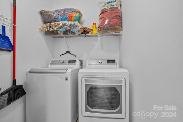 washroom with washer and dryer