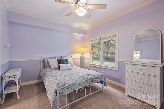 carpeted bedroom featuring ornamental molding and ceiling fan