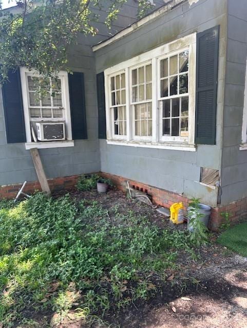 view of side of property featuring cooling unit