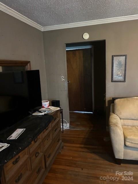 office area with dark hardwood / wood-style floors, a textured ceiling, and ornamental molding