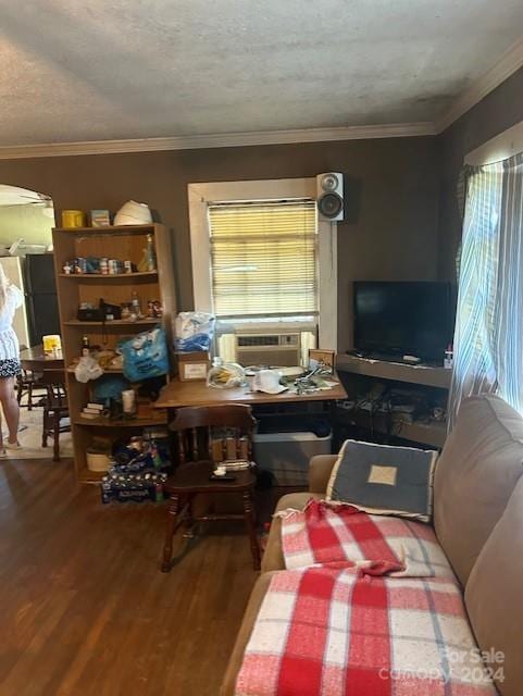 living room with crown molding, cooling unit, and hardwood / wood-style floors