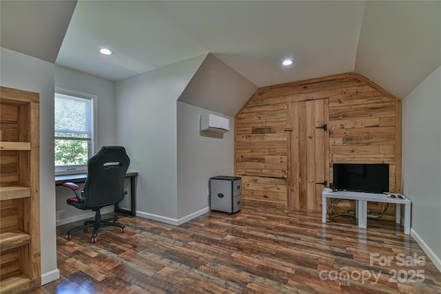 office space with dark hardwood / wood-style flooring, lofted ceiling, and a wall mounted AC