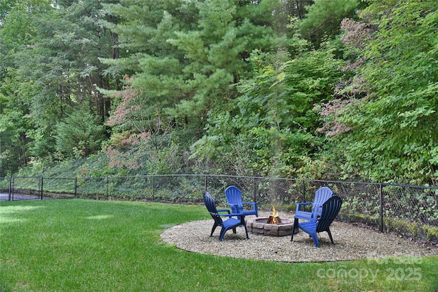 view of yard with an outdoor fire pit