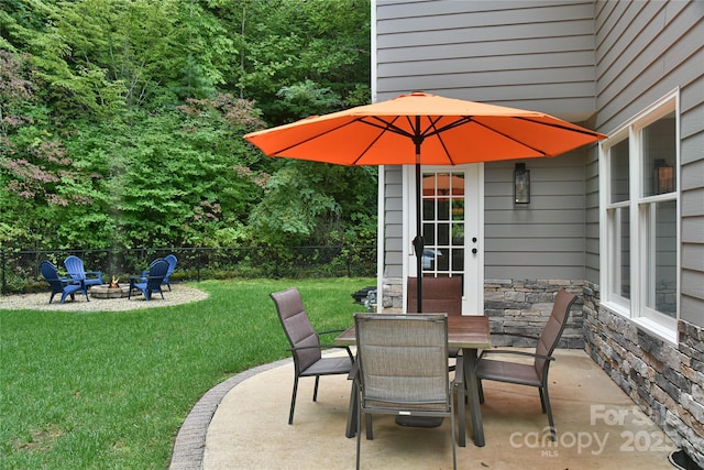 view of patio / terrace with an outdoor fire pit