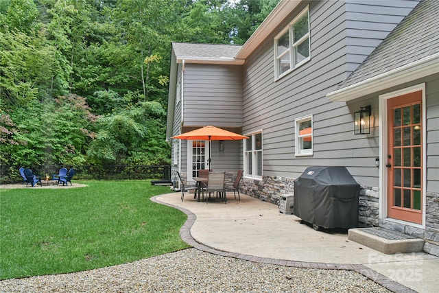 view of yard featuring a fire pit and a patio area