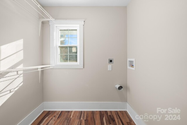 washroom with hookup for a washing machine, dark hardwood / wood-style flooring, and electric dryer hookup