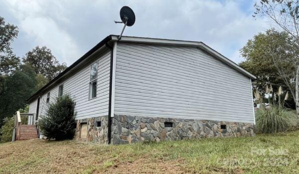 view of property exterior featuring a yard