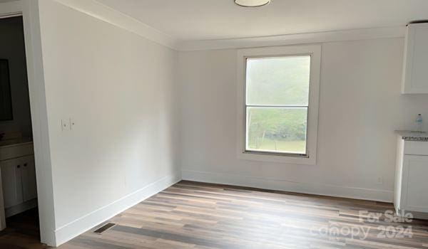 unfurnished dining area with light hardwood / wood-style flooring