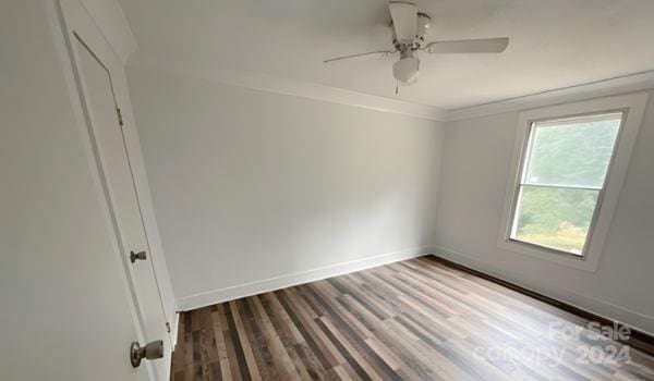 unfurnished room featuring hardwood / wood-style floors, ceiling fan, and ornamental molding