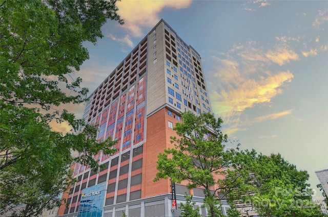 view of outdoor building at dusk