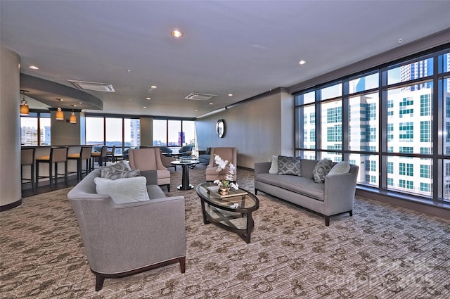 living room featuring a view of city and recessed lighting