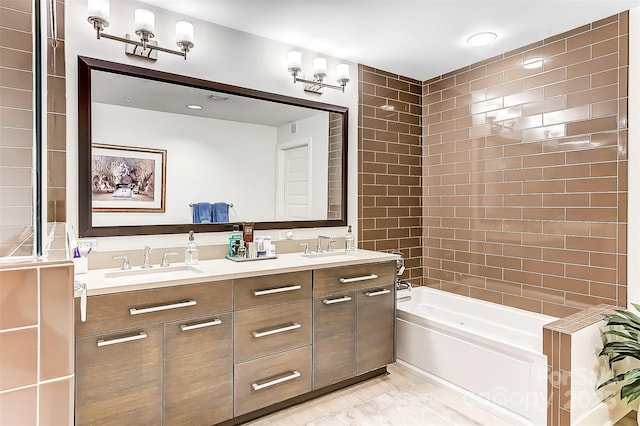 bathroom with shower / bathtub combination, double vanity, and a sink