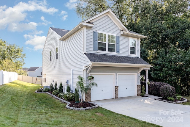 view of front of property with cooling unit, a garage, and a front lawn