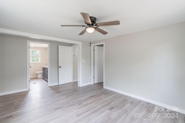 empty room featuring ceiling fan and light hardwood / wood-style floors