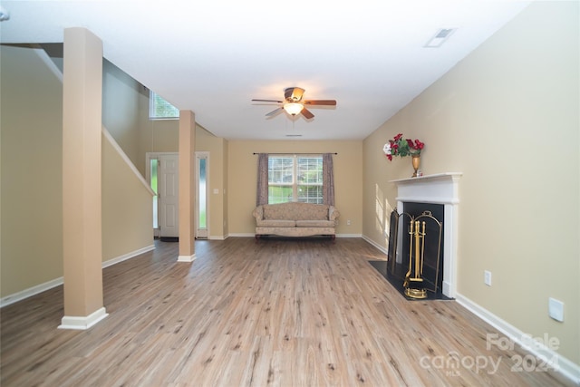 unfurnished living room with light hardwood / wood-style flooring and ceiling fan