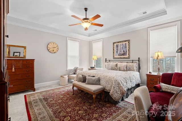 bedroom featuring light carpet, baseboards, visible vents, and ornamental molding