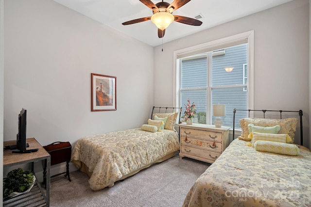 carpeted bedroom featuring a ceiling fan