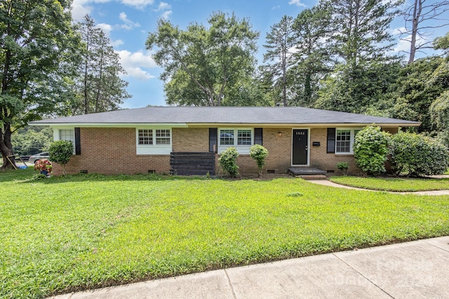 ranch-style house featuring crawl space, a front yard, and brick siding