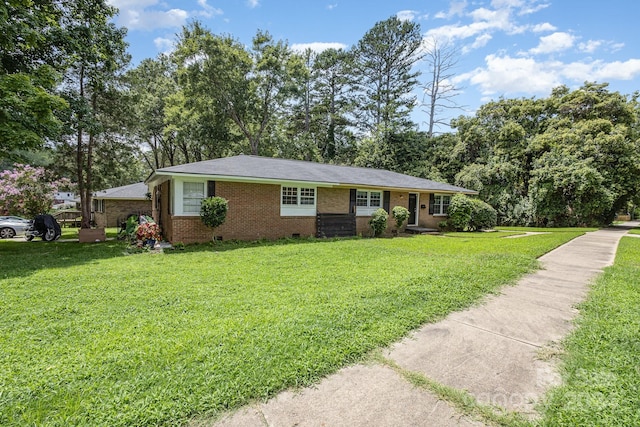 ranch-style house featuring a front lawn