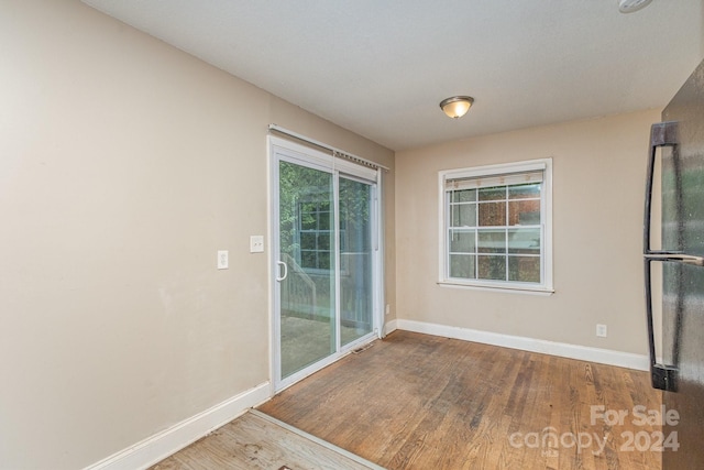 entryway featuring wood finished floors and baseboards