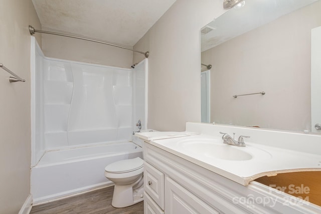 full bathroom with visible vents, toilet, vanity, wood finished floors, and  shower combination