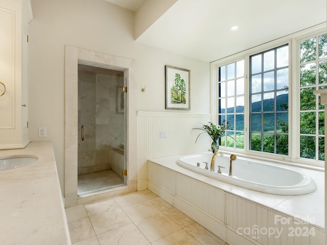 bathroom with tile patterned flooring, a healthy amount of sunlight, a water and mountain view, and plus walk in shower