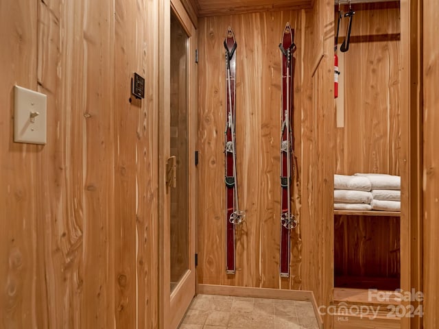 interior space featuring wood walls and tile patterned floors