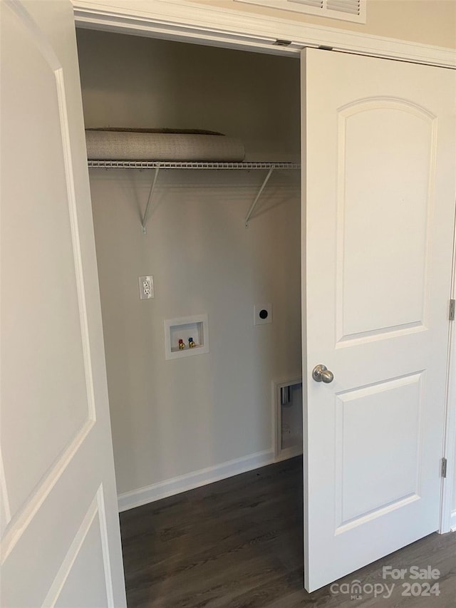 washroom with hookup for an electric dryer, washer hookup, and dark hardwood / wood-style floors