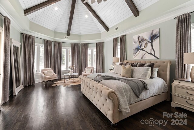 bedroom with beam ceiling, dark wood-type flooring, and high vaulted ceiling