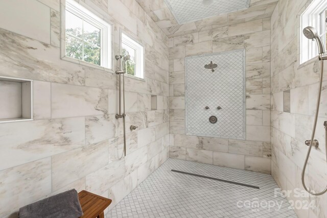 bathroom featuring a tile shower