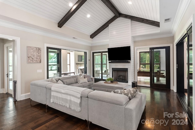 living room featuring vaulted ceiling with beams, crown molding, a fireplace, and dark hardwood / wood-style flooring