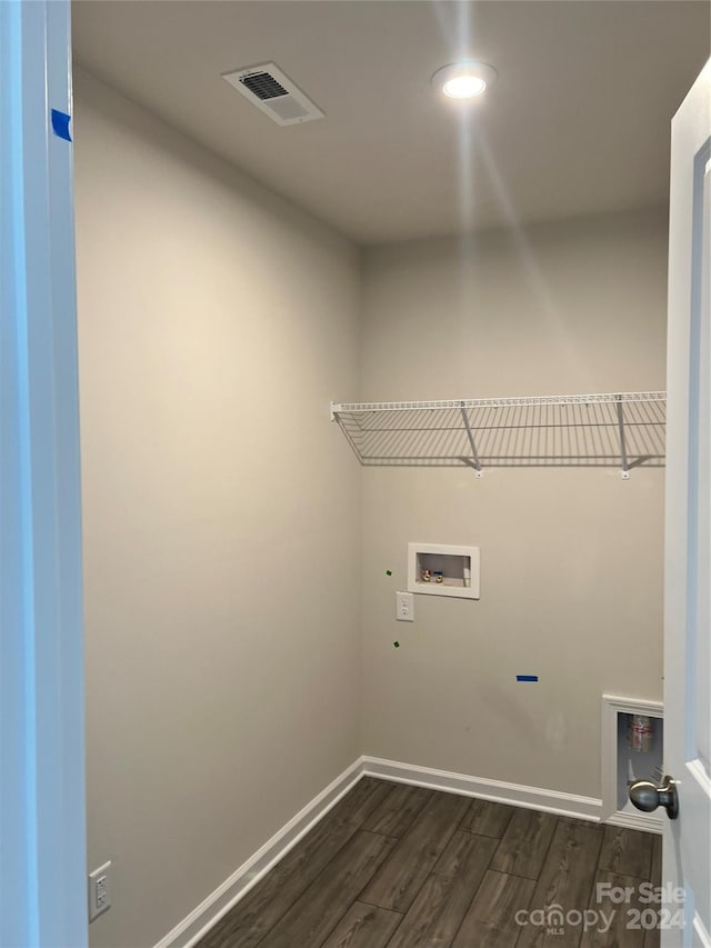 clothes washing area featuring hookup for a washing machine and hardwood / wood-style floors