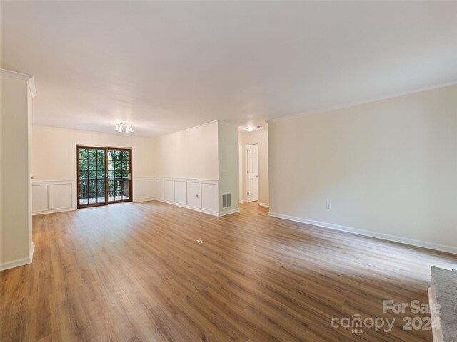 unfurnished living room with light hardwood / wood-style flooring