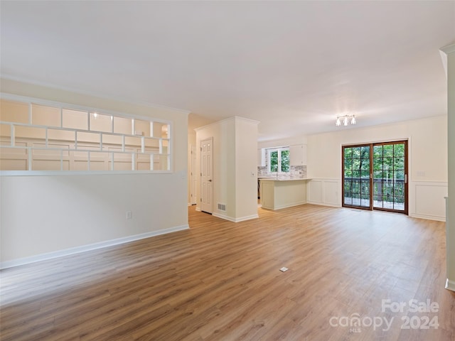 unfurnished living room with light wood-type flooring