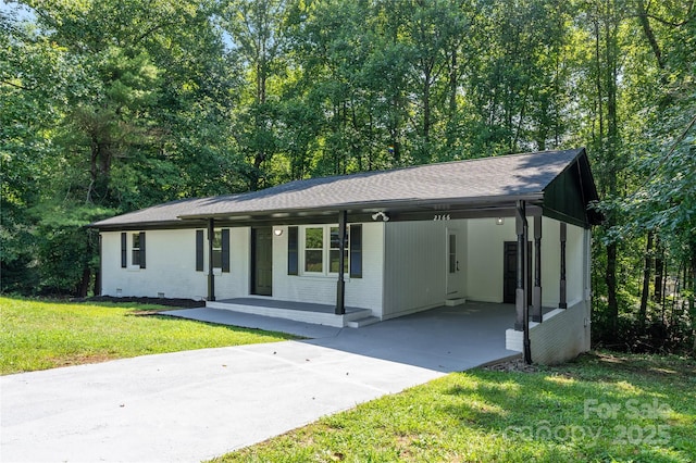 ranch-style house with a shingled roof, crawl space, covered porch, a front lawn, and brick siding