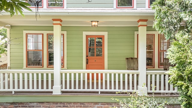 doorway to property featuring a porch